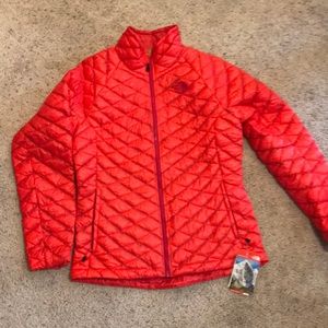 New North Face red puffy jacket